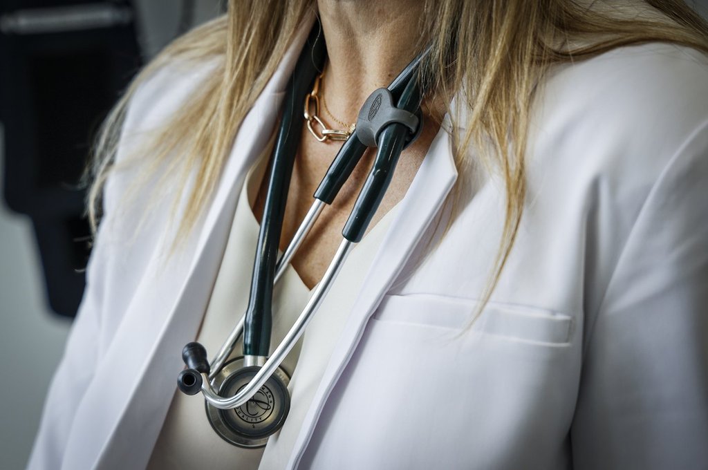 A doctor wears a lab coat and stethoscope in an exam room on Friday, July 14, 2023. THE CANADIAN PRESS/Jeff McIntosh.