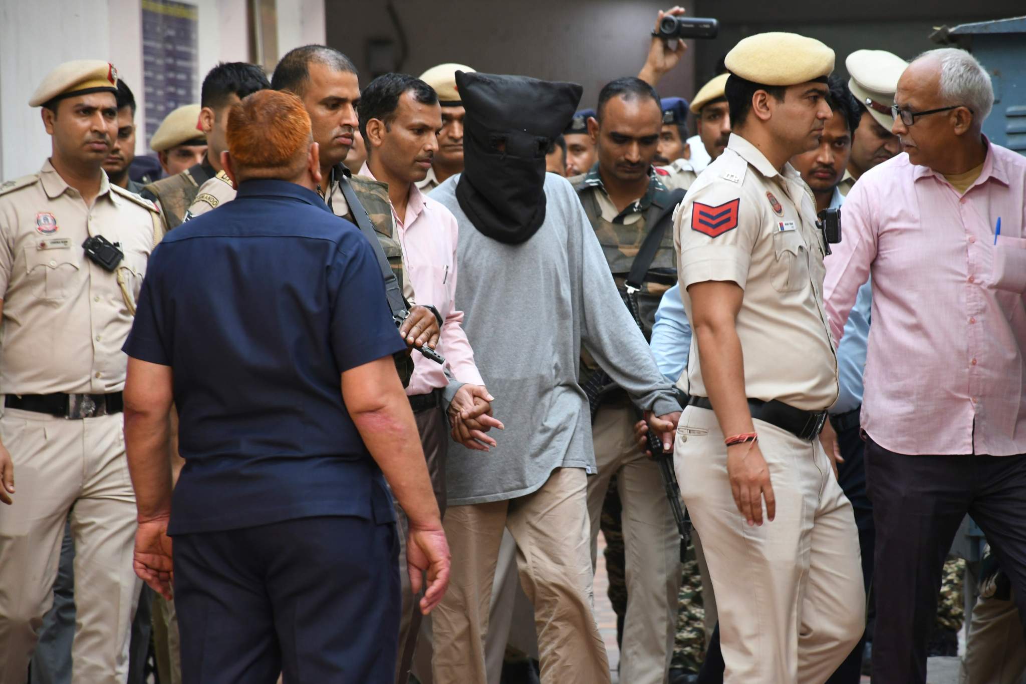 Tahawwur Rana is escorted to court in New Delhi, India, April 28, 2025. (AP Photo/Dinesh Joshi)